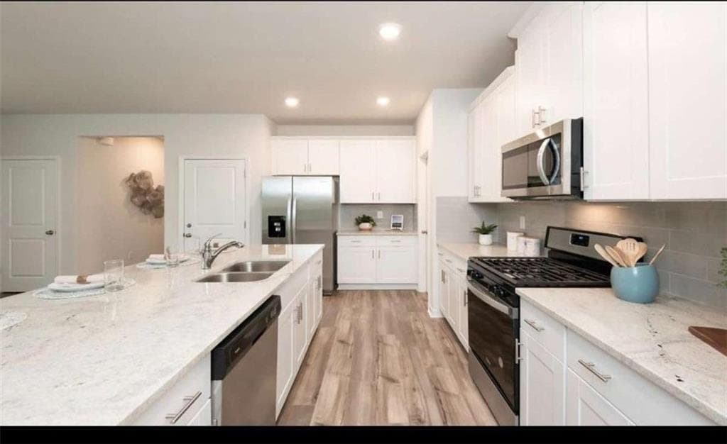 5 bedroom, 3 bathroom, 2,420 sq ft single family residence for sale at 104 NESBIT Drive, Holly Springs, GA 30114 — photo 7