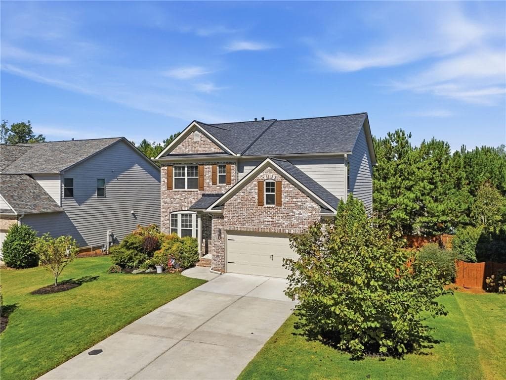 4 bedroom, 3 bathroom, 2,336 sq ft single family residence for sale at 4125 Spring Ridge Drive, Cumming, GA 30028 — photo 2