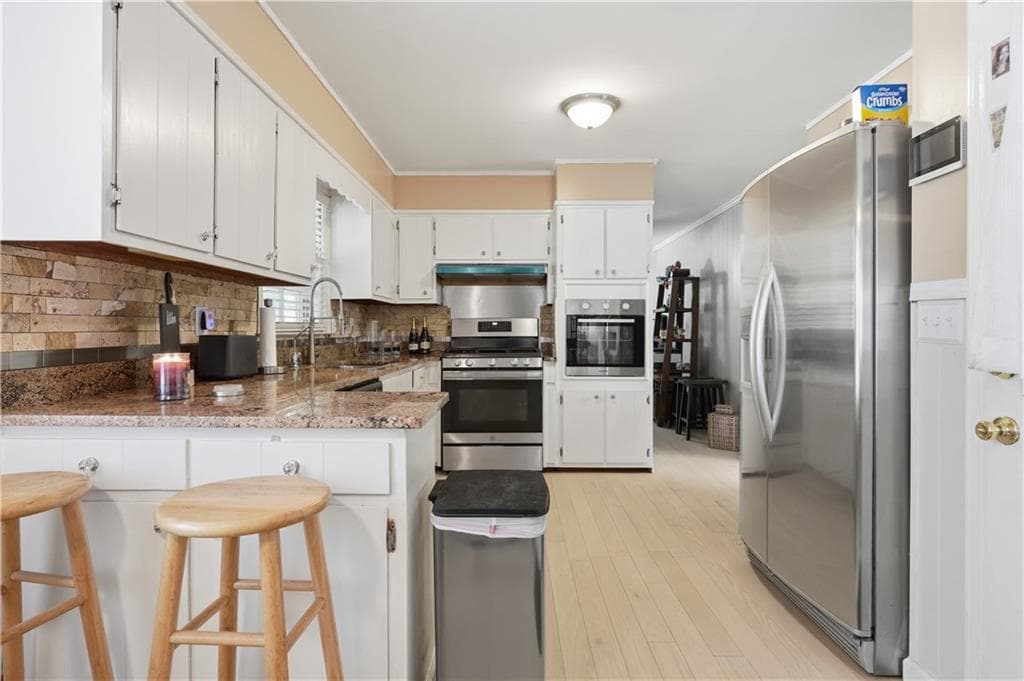 4 bedroom, 3 bathroom, 1,978 sq ft single family residence for sale at 6828 Rockland Road, Lithonia, GA 30038 — photo 8