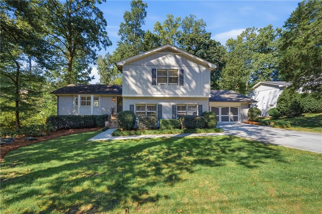 5 bedroom, 3 bathroom, 2,908 sq ft single family residence for sale at 4946 Village Creek Drive, Dunwoody, GA 30338 — photo 1 of 58