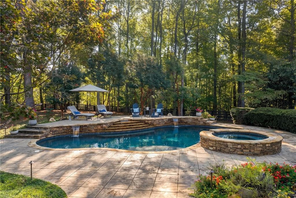 6 bedroom, 7 bathroom, 8,292 sq ft single family residence for sale at 135 Foxhollow Trail, Milton, GA 30004 — photo 2