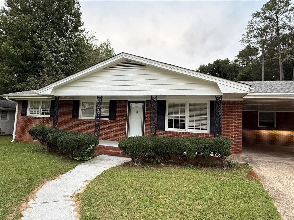 4 bedroom, 2 bathroom, 1,228 sq ft single family residence for sale at 6359 Lanier Road, Morrow, GA 30260 — photo 2