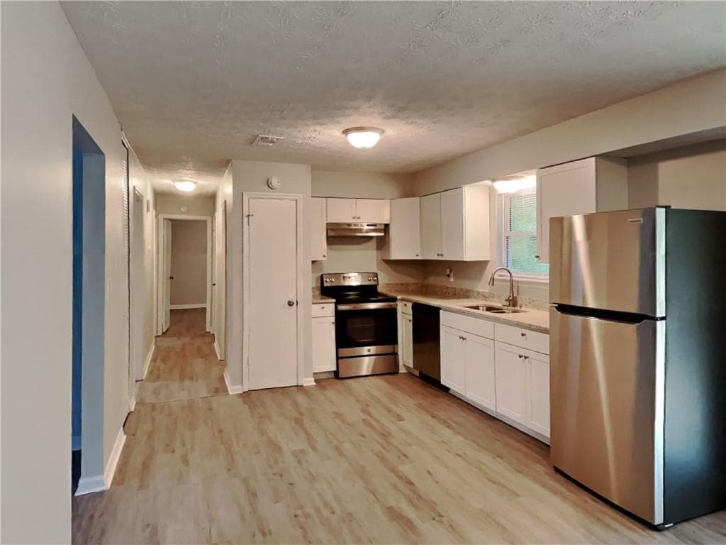 3 bedroom, 2 bathroom, 1,344 sq ft single family residence for rent at 2938 Woodfield Drive, Rex, GA 30273 for $1,790 a month — photo 2