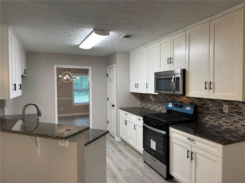 4 bedroom, 3 bathroom, 2,332 sq ft single family residence for rent at 7454 Woody Springs Drive, Flowery Branch, GA 30542 for $2,300 a month — photo 9