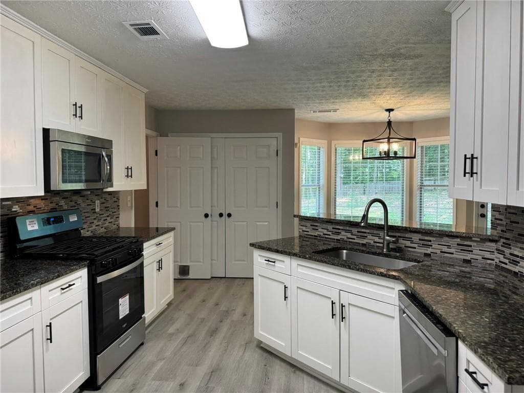 4 bedroom, 3 bathroom, 2,332 sq ft single family residence for rent at 7454 Woody Springs Drive, Flowery Branch, GA 30542 for $2,300 a month — photo 10
