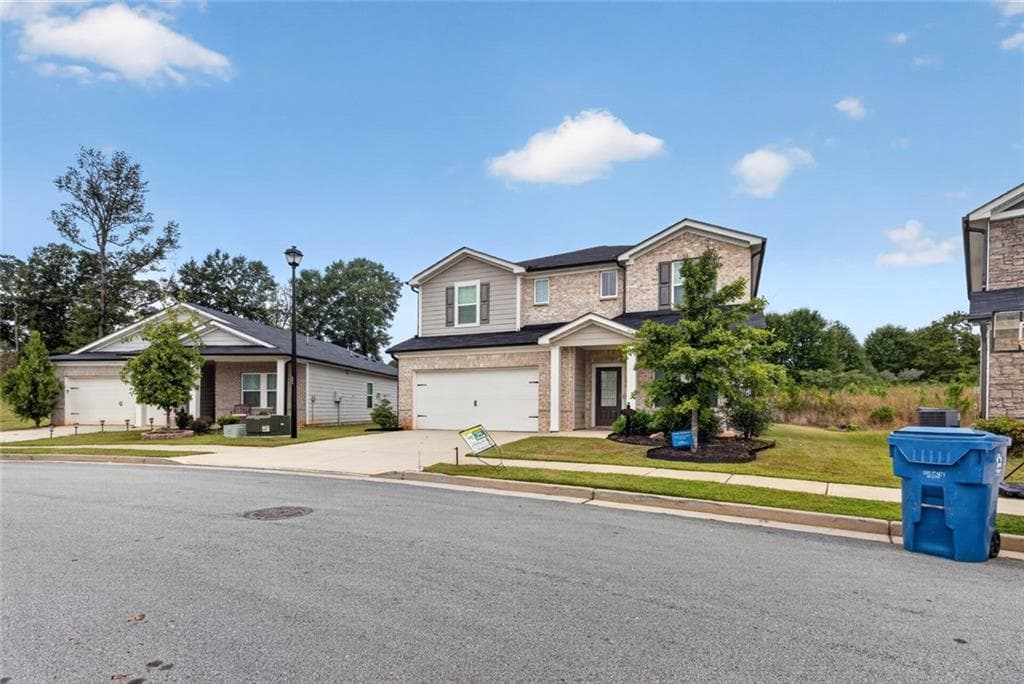 5 bedroom, 3 bathroom, 3,007 sq ft single family residence for sale at 5911 Green Ash Court, Braselton, GA 30517 — photo 2