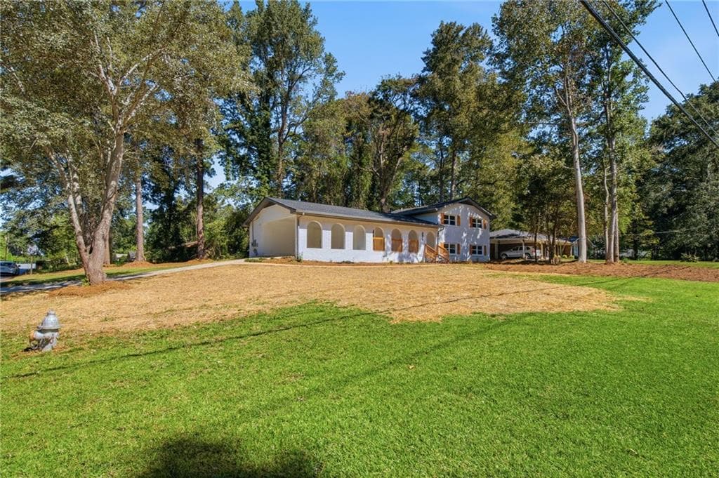 5 bedroom, 3 bathroom, 2,331 sq ft single family residence for sale at 4804 Thompson Mill Road, Lithonia, GA 30038 — photo 3