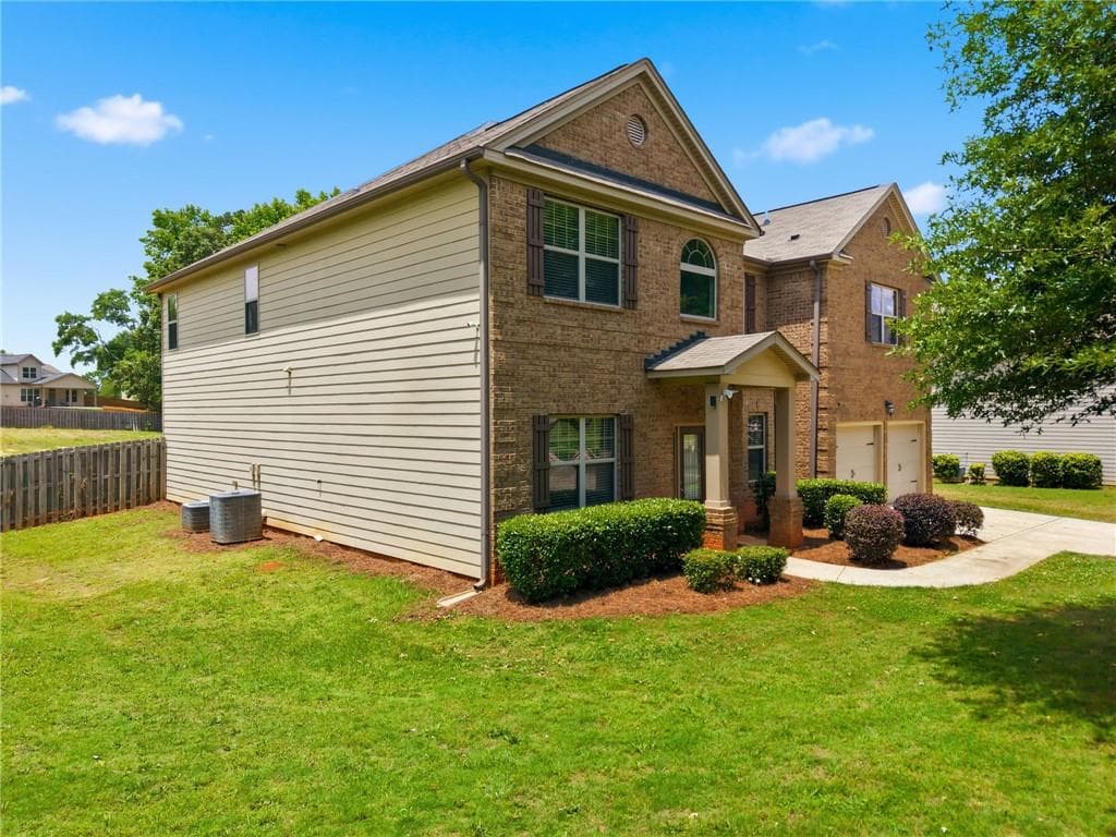 5 bedroom, 4 bathroom, 4,185 sq ft single family residence for sale at 9001 Dawes Crossing, Mcdonough, GA 30252 — photo 2