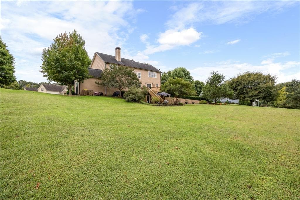 6 bedroom, 4 bathroom, 4,110 sq ft single family residence for sale at 258 Downing Street, Hoschton, GA 30548 — photo 4