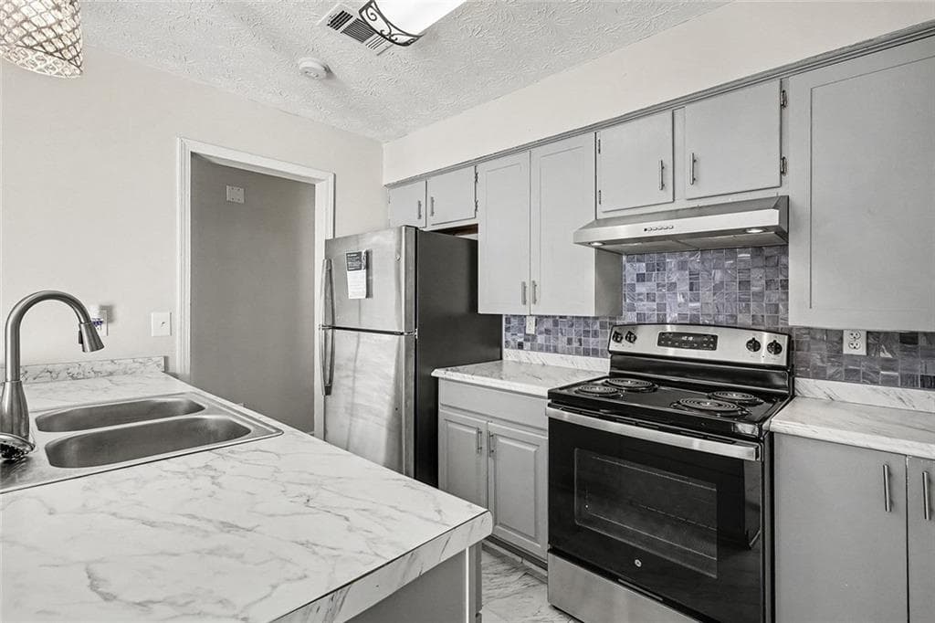 3 bedroom, 2 bathroom, 1,128 sq ft single family residence for sale at 694 Waterview Drive, Riverdale, GA 30274 — photo 6