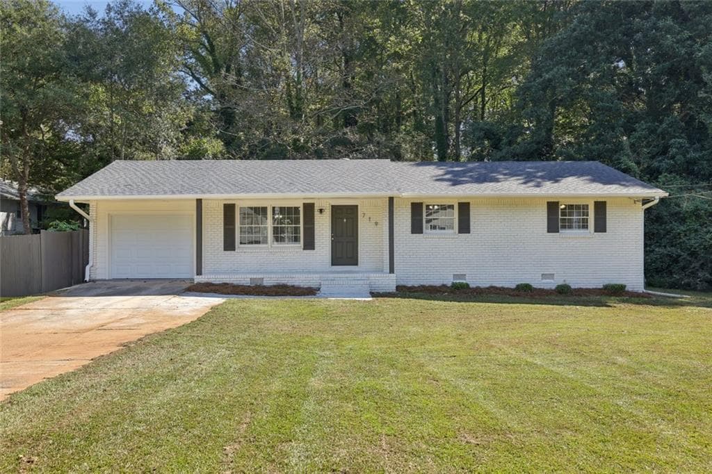3 bedroom, 3 bathroom, 1,204 sq ft single family residence for sale at 719 San Miguel Drive, Stone Mountain, GA 30083 — photo 1 of 33