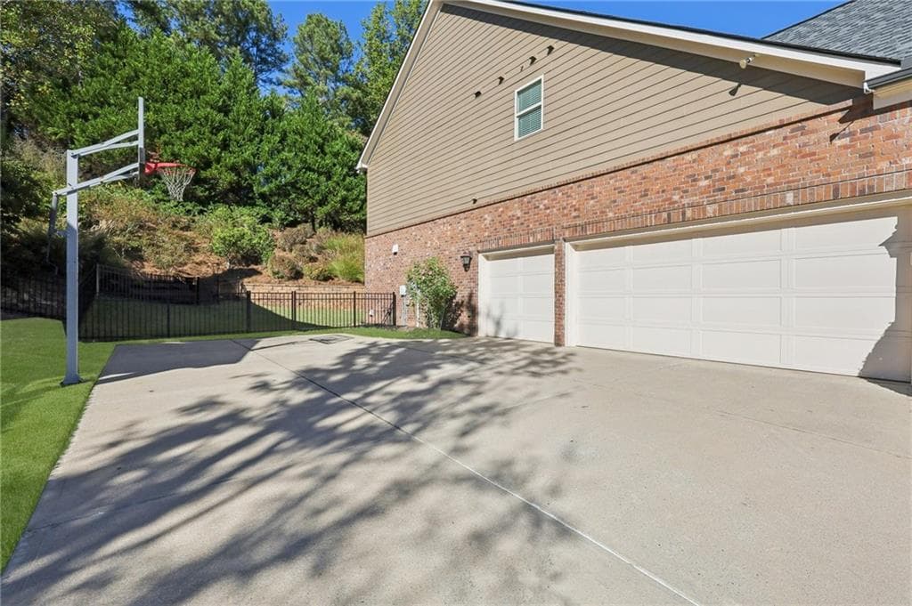 6 bedroom, 5 bathroom, 5,255 sq ft single family residence for sale at 2315 Copper Mill Trail, Cumming, GA 30041 — photo 2