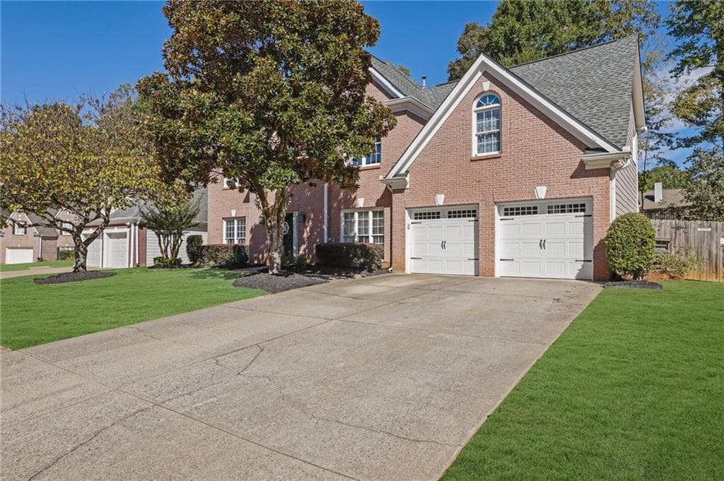 4 bedroom, 3 bathroom, 3,173 sq ft single family residence for sale at 5061 Tottenham Court, Suwanee, GA 30024 — photo 2