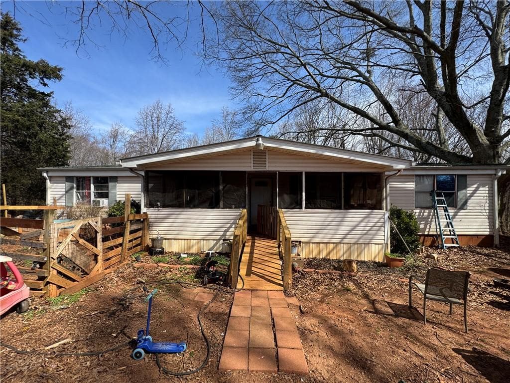 4 bedroom, 3 bathroom, 1,248 sq ft single family residence for sale at 8943 John Savage Road, Lula, GA 30554