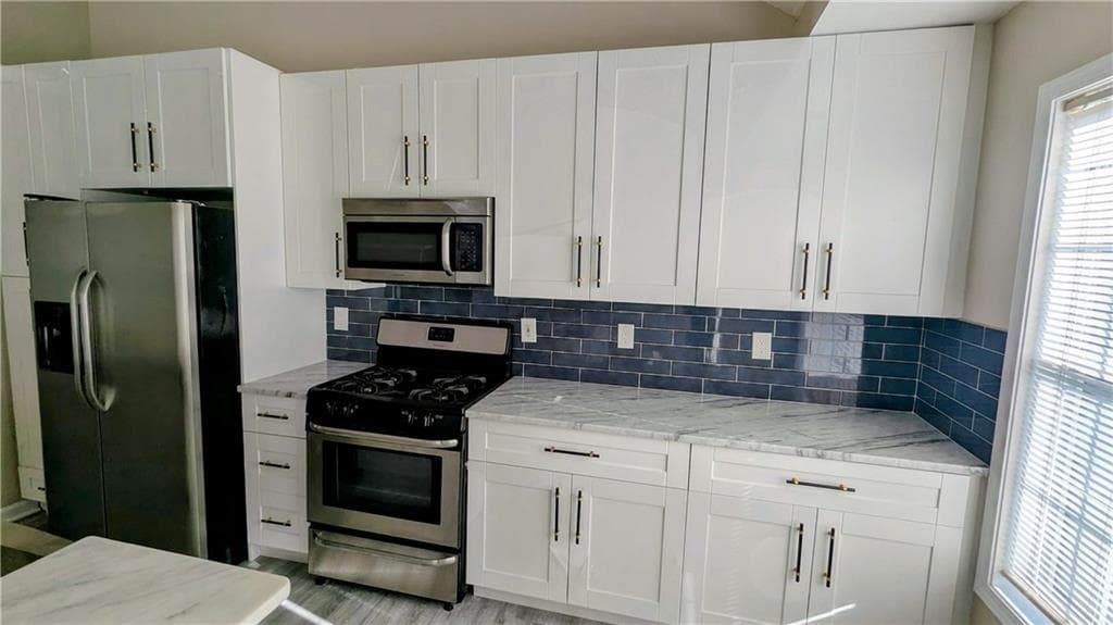 4 bedroom, 3 bathroom, 2,021 sq ft single family residence for sale at 3908 Mcguire Way, Kennesaw, GA 30144 — photo 8