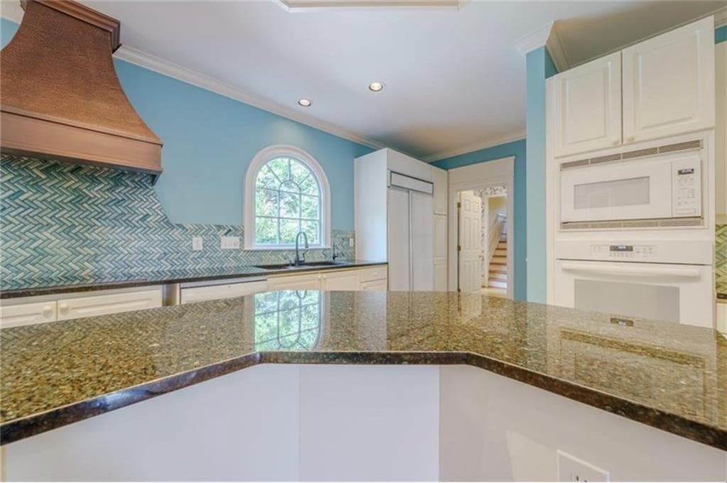 6 bedroom, 5 bathroom, 5,641 sq ft single family residence for sale at 1357 Baniff Court, Snellville, GA 30078 — photo 6