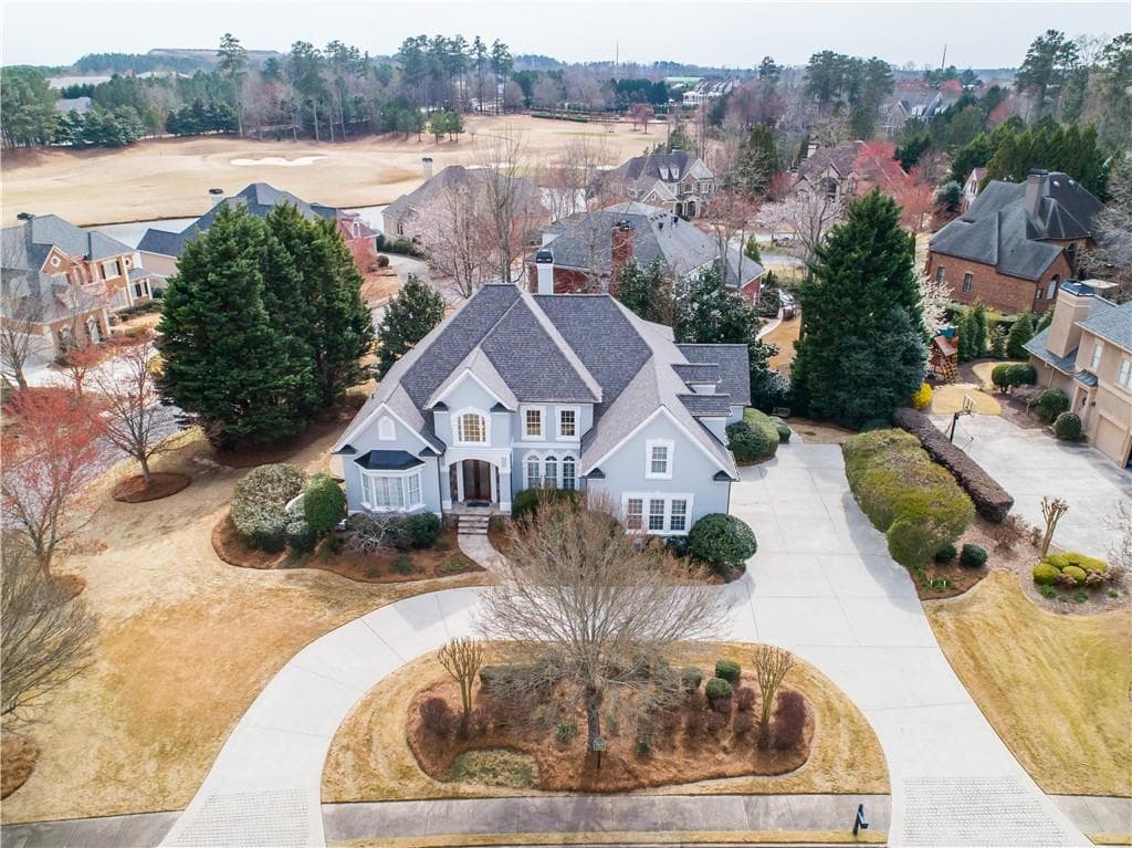 6 bedroom, 6 bathroom, 6,120 sq ft single family residence sold at 5640 Laurel Oak Drive, Suwanee, GA 30024