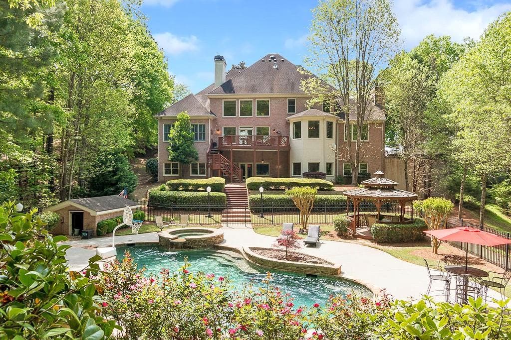6 bedroom, 7 bathroom, 7,590 sq ft single family residence sold at 8696 River Bluff Lane, Roswell, GA 30076