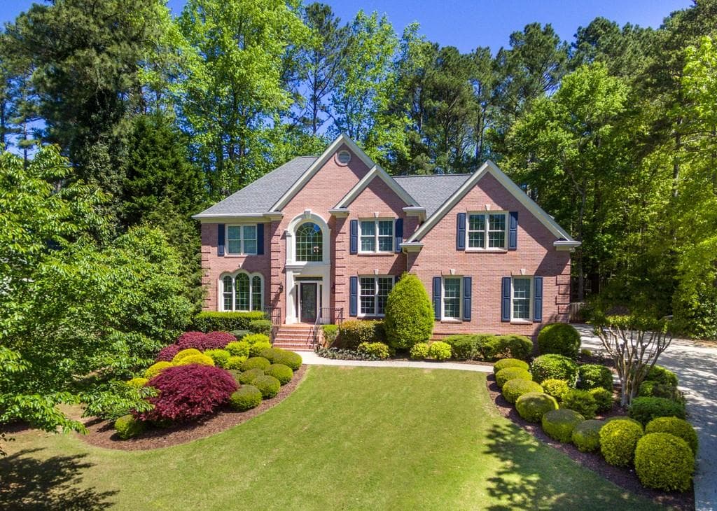 6 bedroom, 5 bathroom, 6,238 sq ft single family residence sold at 6760 POLO Drive, Cumming, GA 30040