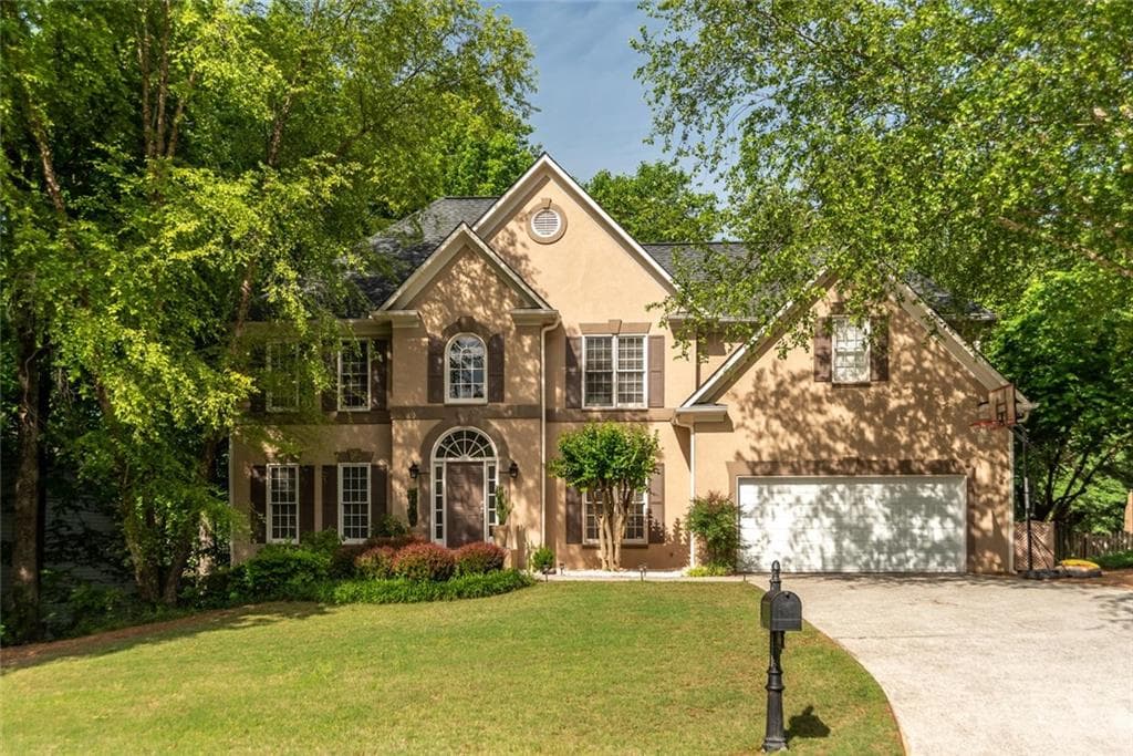 5 bedroom, 4 bathroom, 4,113 sq ft single family residence sold at 5490 Ashewoode Downs Drive, Alpharetta, GA 30005