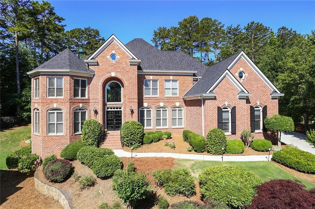 6 bedroom, 5 bathroom, 6,229 sq ft single family residence sold at 750 Falls Landing Court, Johns Creek, GA 30022