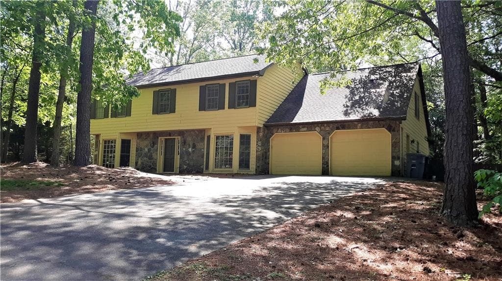 5 bedroom, 3 bathroom, 2,832 sq ft single family residence sold at 590 Ridgemont Drive, Roswell, GA 30076