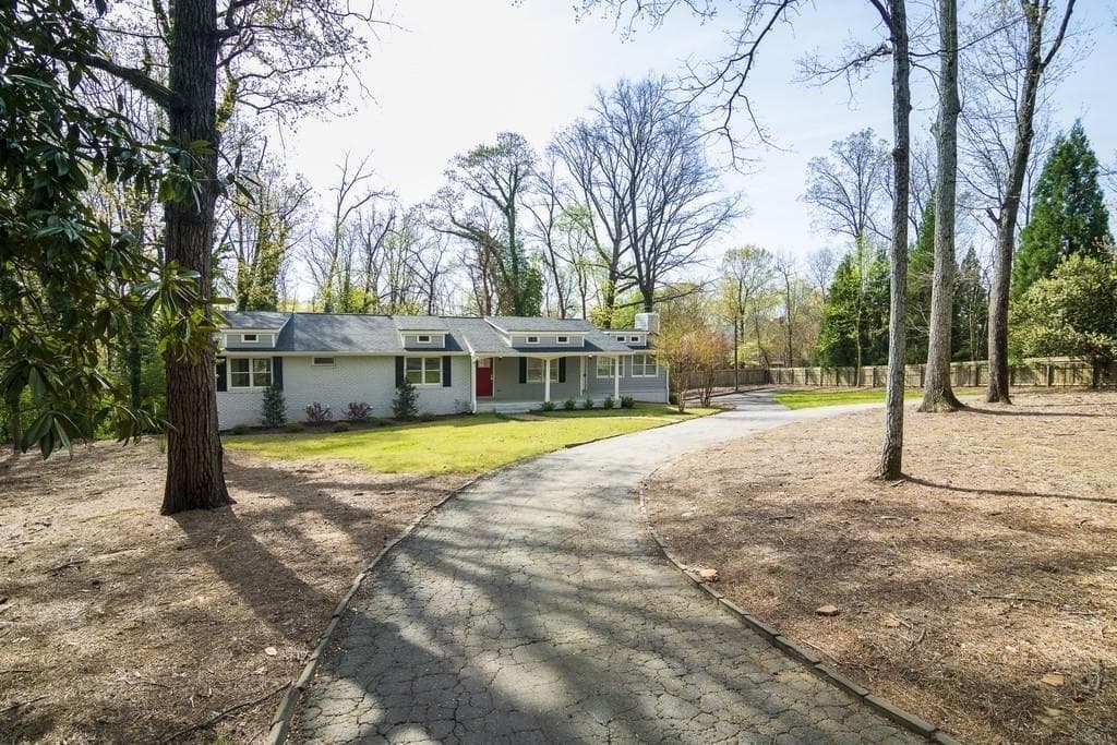 5 bedroom, 4 bathroom, 3,876 sq ft single family residence sold at 410 Mt Vernon Highway, Atlanta, GA 30327