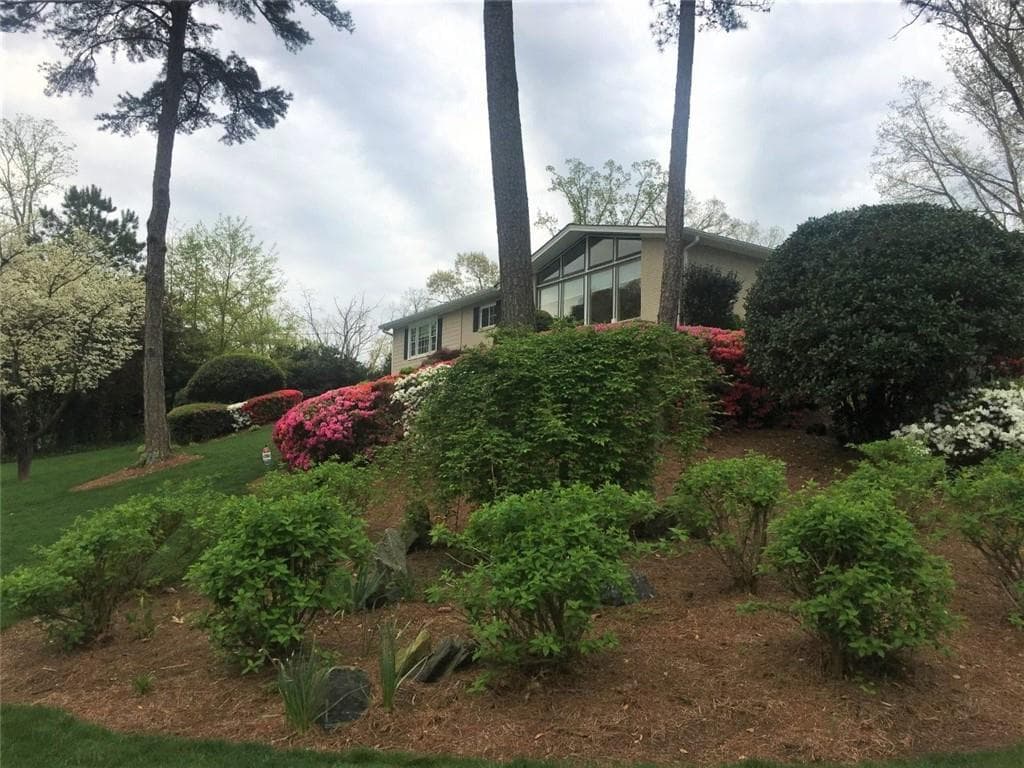 4 bedroom, 3 bathroom, 3,920 sq ft single family residence sold at 6533 Cherry Tree Lane, Atlanta, GA 30328