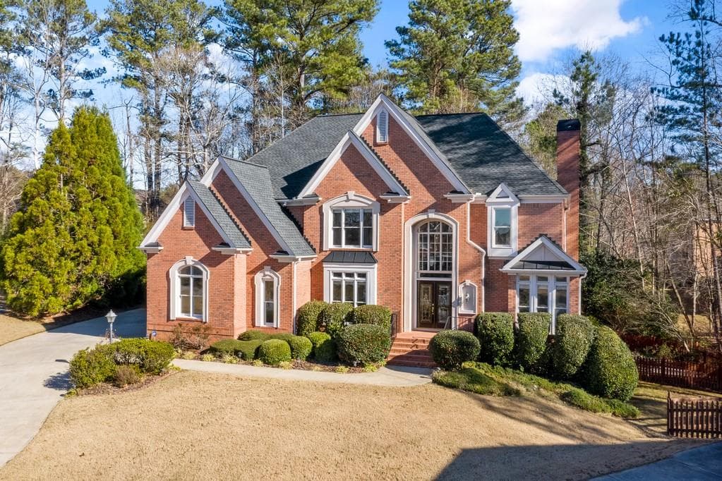 5 bedroom, 5 bathroom, 5,699 sq ft single family residence sold at 115 ASHBURN Circle, Johns Creek, GA 30022