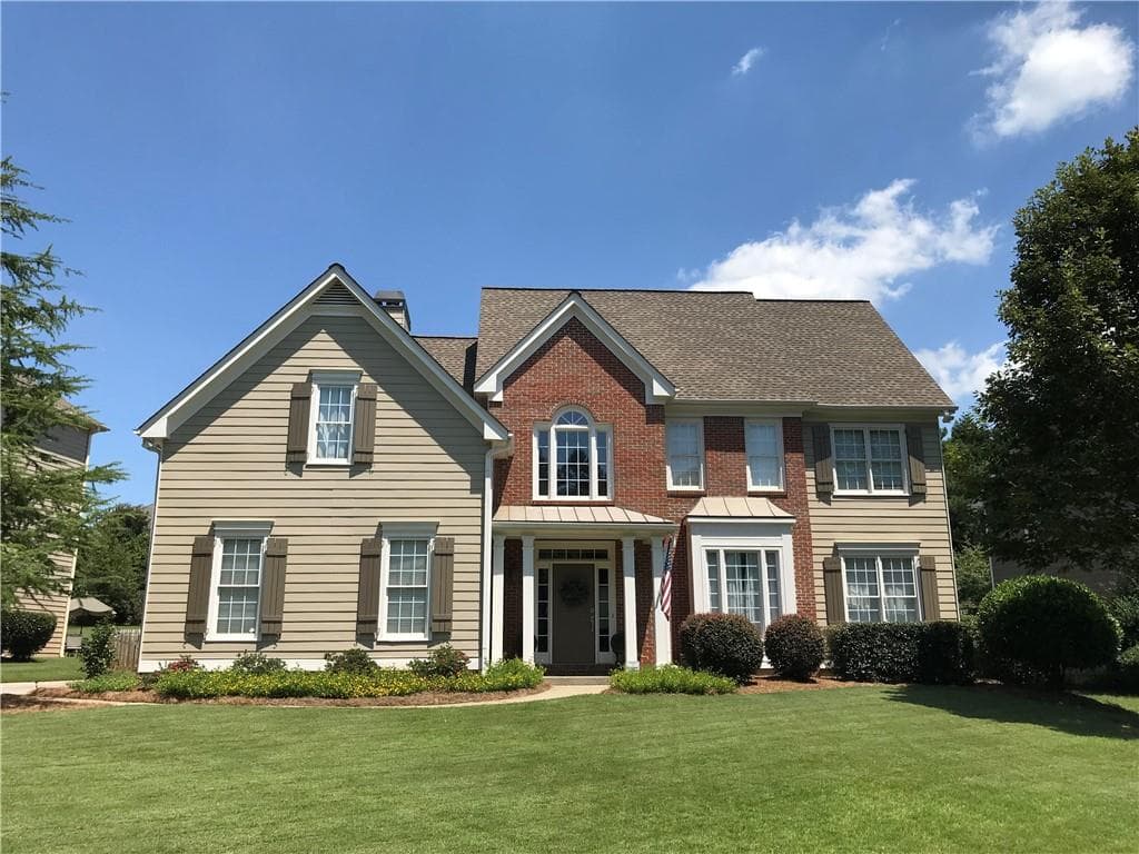 4 bedroom, 3 bathroom, 2,900 sq ft single family residence sold at 4129 Treemont Lane, Suwanee, GA 30024