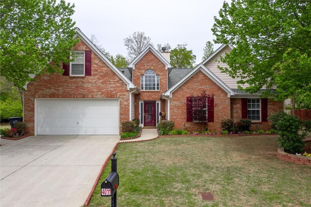 4 bedroom, 2 bathroom, 2,476 sq ft single family residence sold at 4011 OAK CROSSING Drive, Suwanee, GA 30024