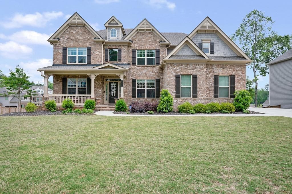 6 bedroom, 5 bathroom, 6,213 sq ft single family residence sold at 411 Silver Brook Drive, Woodstock, GA 30188