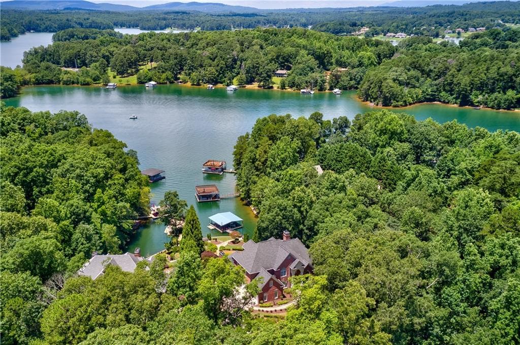 6 bedroom, 7 bathroom, 8,549 sq ft single family residence sold at 7695 Harbour Walk, Cumming, GA 30041