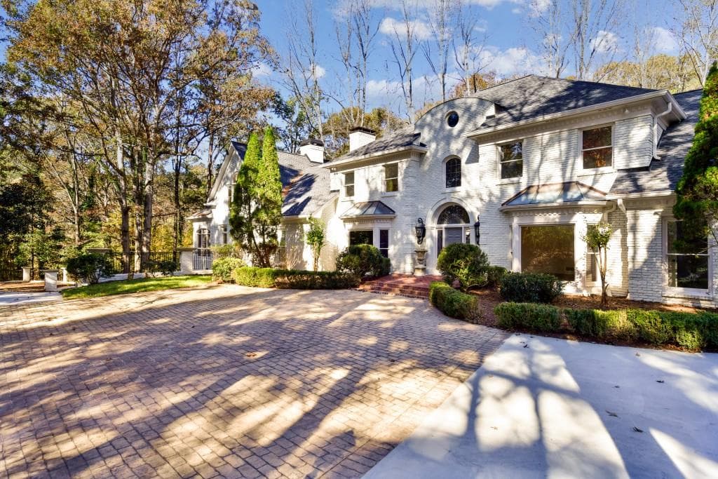6 bedroom, 6 bathroom, 7,300 sq ft single family residence sold at 2580 W Wesley Road, Atlanta, GA 30327