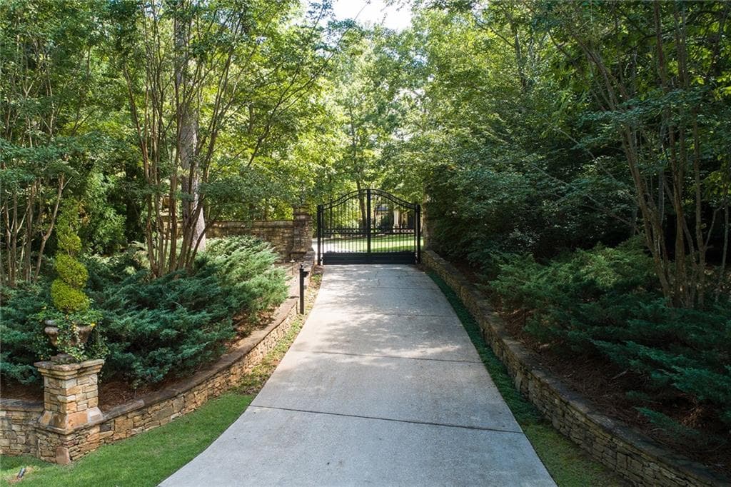7 bedroom, 10 bathroom, 14,826 sq ft single family residence sold at 130 Ryan Lake Trail, Alpharetta, GA 30004