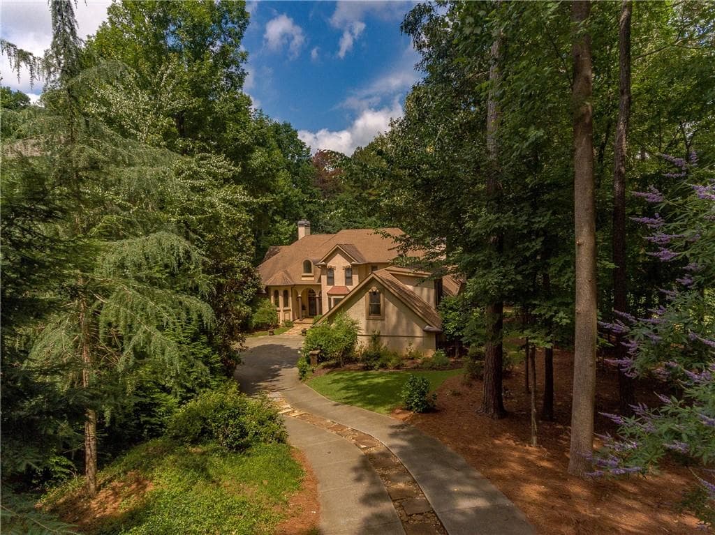7 bedroom, 6 bathroom, 7,122 sq ft single family residence sold at 5041 Towne Lake Hills, Woodstock, GA 30189