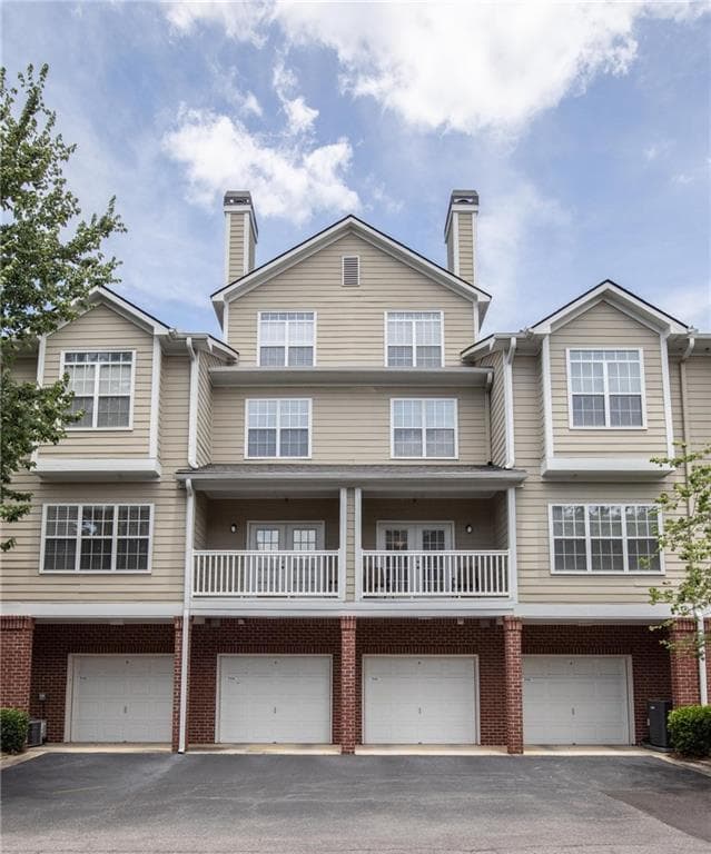 2 bedroom, 3 bathroom, 1,378 sq ft condominium sold at 7111 Woodland Lane, Alpharetta, GA 30009