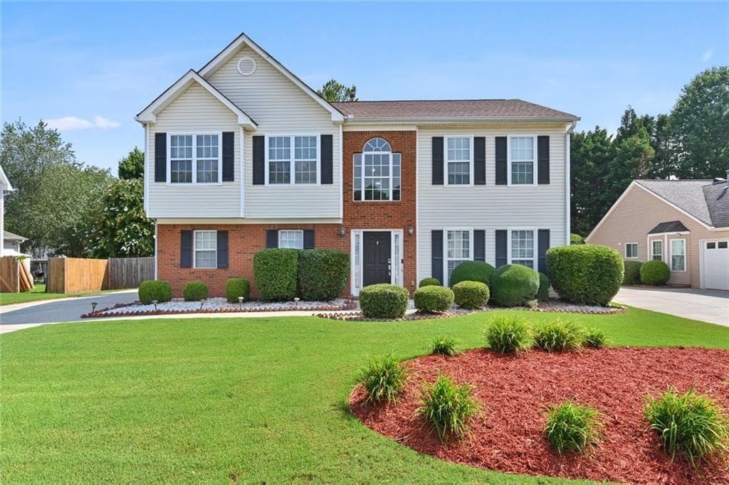 4 bedroom, 3 bathroom, 2,371 sq ft single family residence sold at 3945 Riversong Drive, Suwanee, GA 30024 — photo 1 of 1