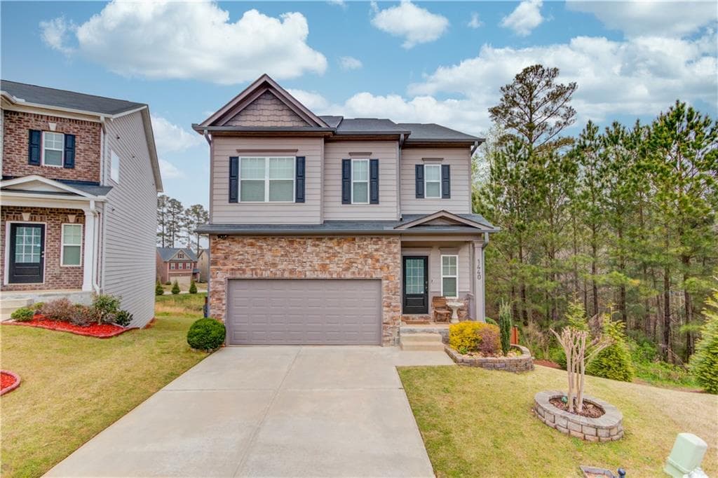 5 bedroom, 4 bathroom, 2,692 sq ft single family residence sold at 1440 Woodward Down Court, Buford, GA 30519