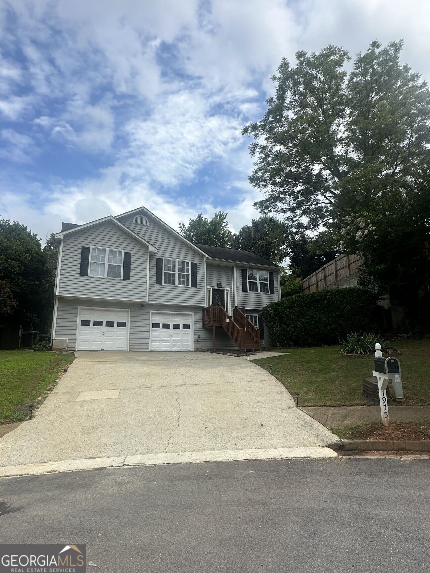 5 bedroom, 2 bathroom single family residence for sale at 1975 Hollow Trace Way, Norcross, GA 30071