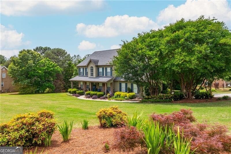 4 bedroom, 2.5 bathroom, 2,328 sq ft single family residence sold at 3295 Spincaster Way, Loganville, GA 30052