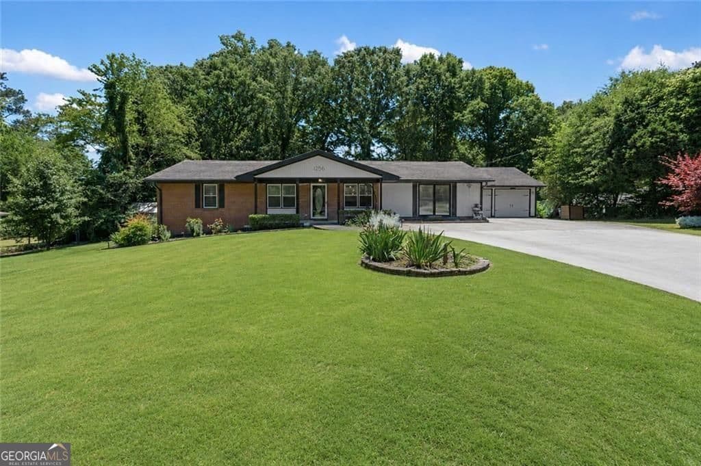 3 bedroom, 2 bathroom, 1,626 sq ft single family residence sold at 1256 Cherokee Trail, Lawrenceville, GA 30043