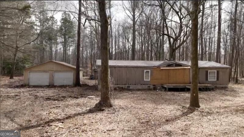 3 bedroom, 2 bathroom, 1,560 sq ft manufactured home,single family residence for sale at 5590 John Burruss Road, Cumming, GA 30040