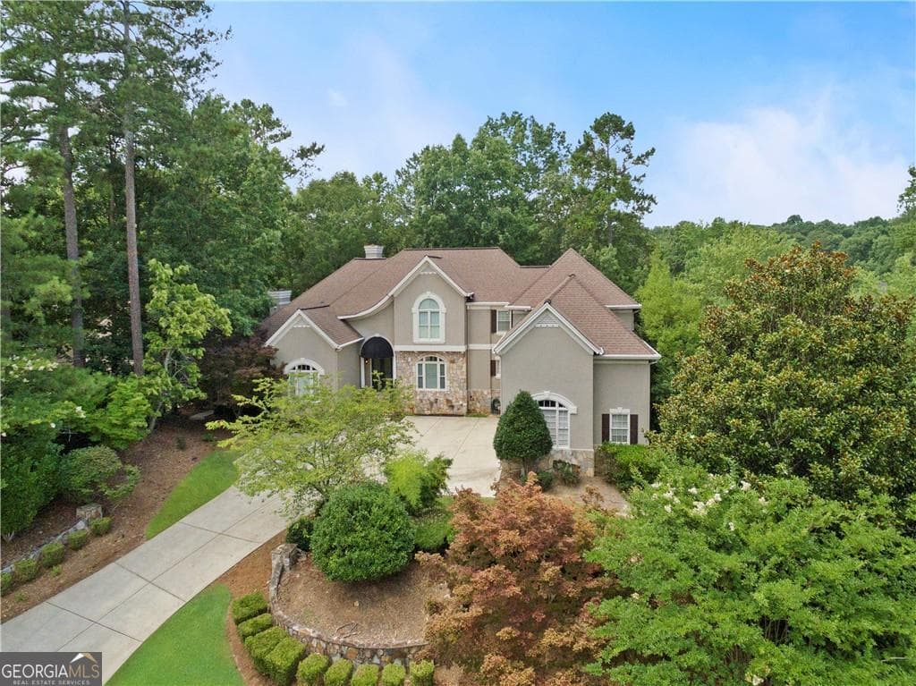 7 bedroom, 4.5 bathroom, 8,582 sq ft single family residence sold at 205 Wicklawn Way, Roswell, GA 30076