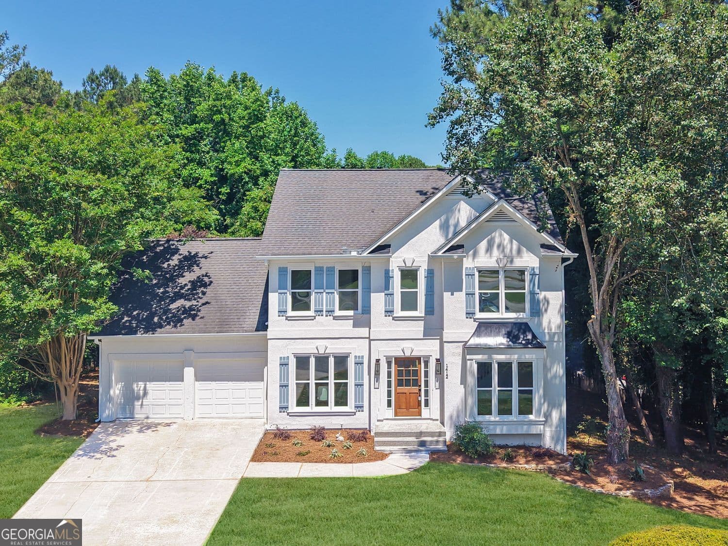 5 bedroom, 3.5 bathroom, 3,698 sq ft single family residence sold at 1412 Winterberry Ridge Circle, Woodstock, GA 30189
