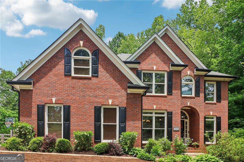 4 bedroom, 3 bathroom, 3,812 sq ft single family residence sold at 1855 Barrett Drive, Cumming, GA 30040