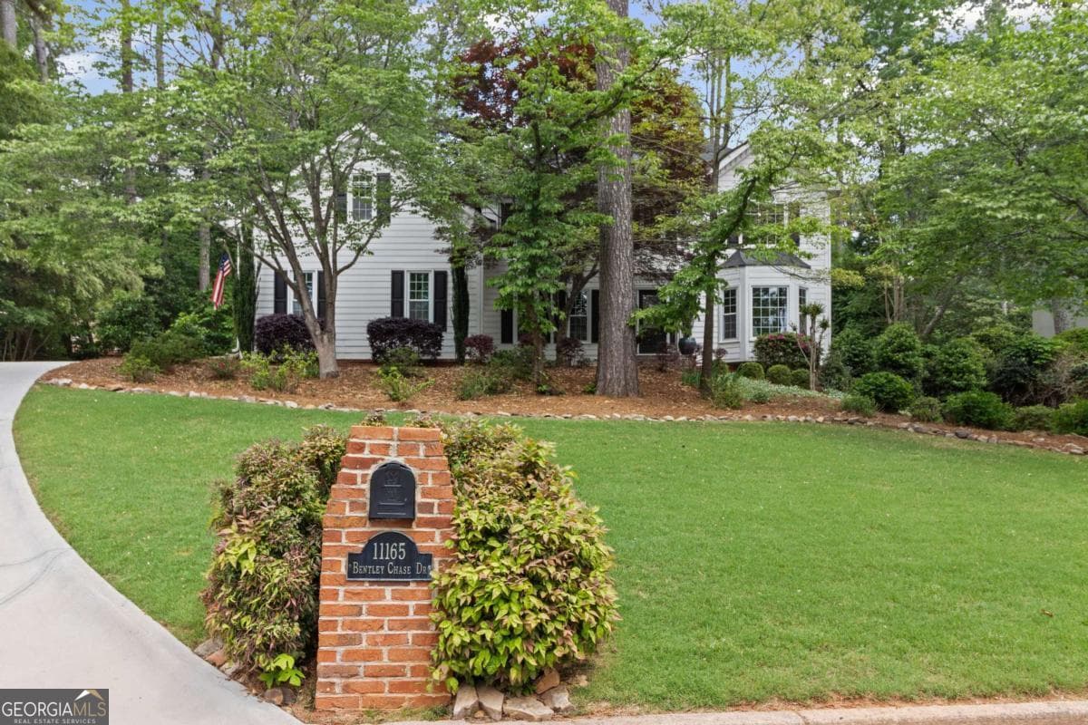 5 bedroom, 3.5 bathroom, 3,815 sq ft single family residence sold at 11165 Bentley Chase Drive, Johns Creek, GA 30097