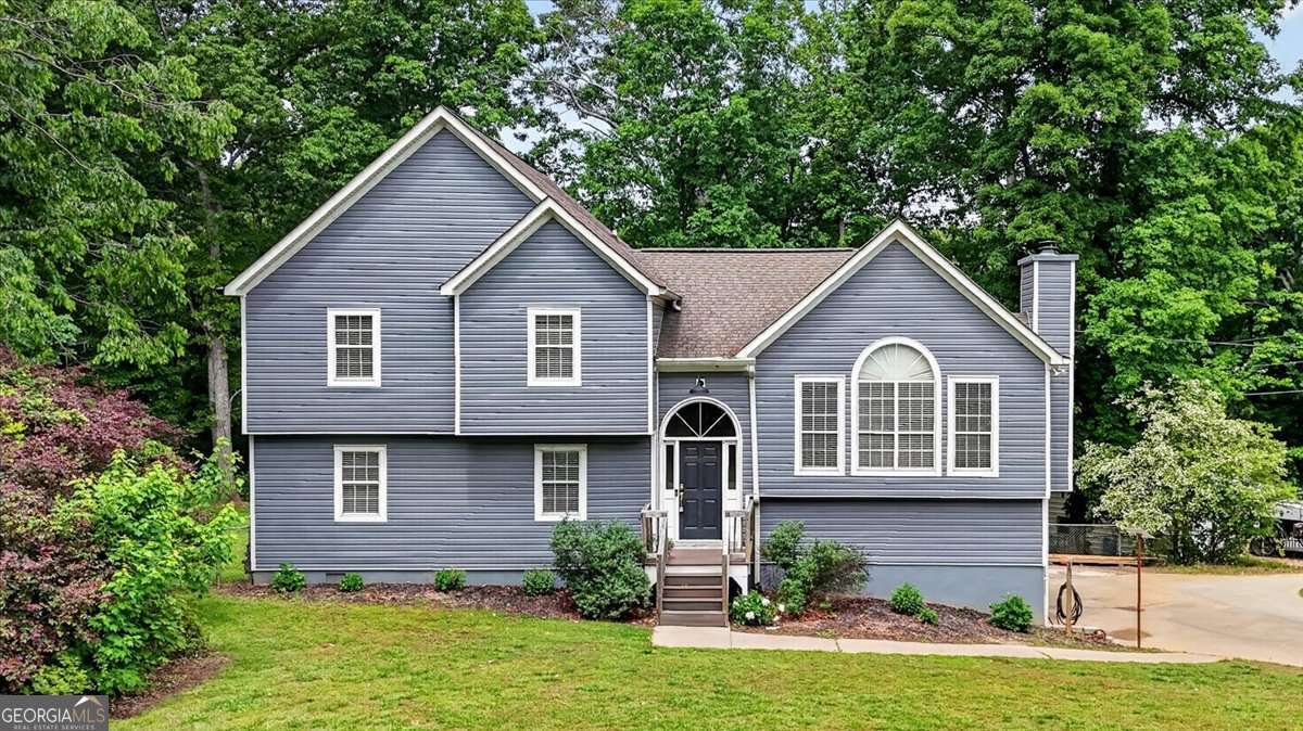 4 bedroom, 3 bathroom, 2,088 sq ft single family residence sold at 980 Woodvalley Drive, Canton, GA 30115