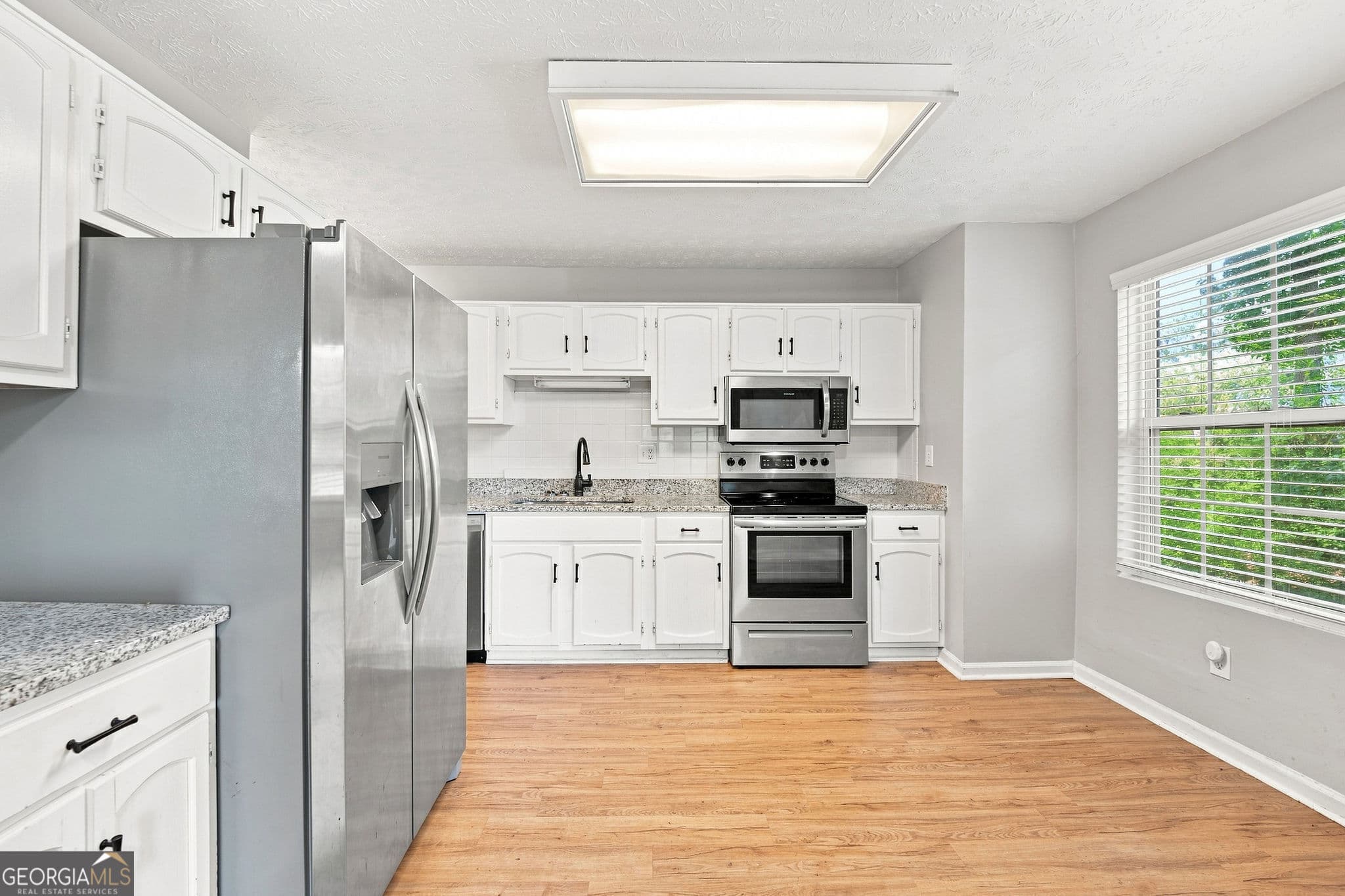 3 bedroom, 2 bathroom, 1,332 sq ft single family residence for sale at 2313 Ivy Crest Drive, Buford, GA 30519