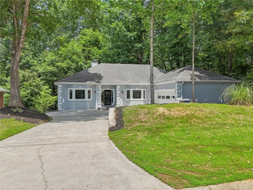 6 bedroom, 4 bathroom, 4,028 sq ft single family residence sold at 1674 Rocky Top Drive, Lilburn, GA 30047
